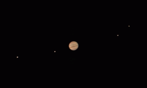 Jupiter and four of its moons